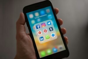 pexels-photo-607812-607812 Person Holding Iphone Showing Social Networks Folder